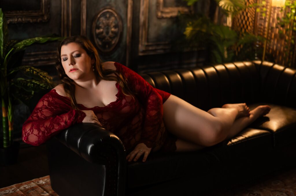 Elegant boudoir portrait in Rochester, NY, showcasing a luxurious and intimate bedroom setting.